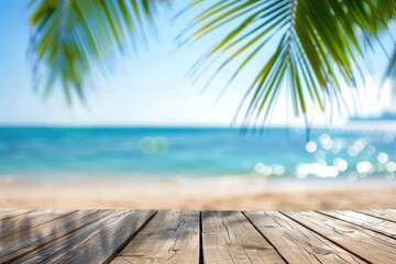 Fototapeta premium Background Summer. Tropical Beach with Palm Leaves on Wooden Table, Sea and Sky Bokeh Lights