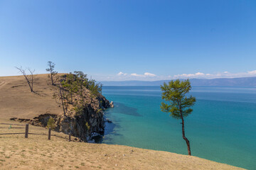 Beautiful view from the shore of Lake Baikal between Khuzhir village and Maly Khuzhir village. Baikal lake, Olkhon island, Irkutsk region, Russia.