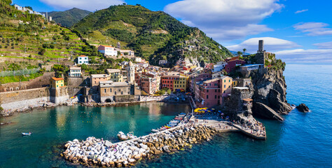 Italy, Cinque terre national park in Liguria. traditional fishing village Vernazza. Aerial panorama with colorful houses and picturesque bay. popular tourist attraction