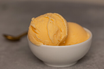 Balls of natural tangerine ice cream