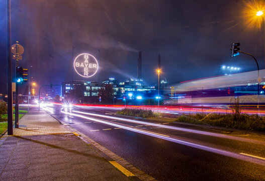 Large BAYER sign at night on the company's production buildings in Leverkusen