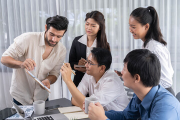 Group of diverse office worker employee working together on strategic business marketing planning in corporate office room. Positive teamwork in business workplace concept. Prudent