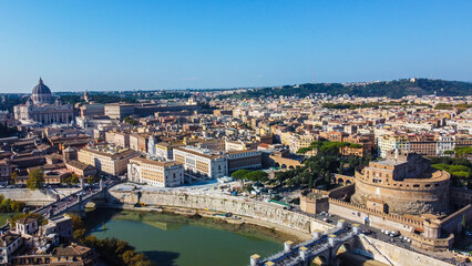 Fototapeta premium Aerial view of a historic castle in Rome, Italy, with St. Peter’s Basilica visible in the Vatican background
