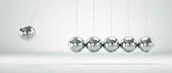 Newton's cradle demonstrating conservation of momentum and energy