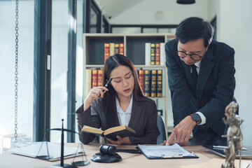 Legal Expertise: A seasoned lawyer mentors a young associate, guiding her through a legal document in a professional and encouraging setting.  