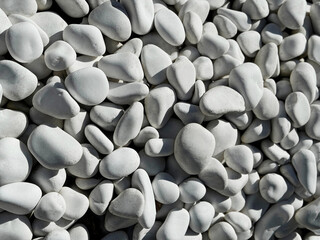 White smooth stones pebbles background 