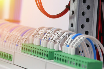 Connection of electrical modules using insulated mounting wires. Close-up. Soft focus.