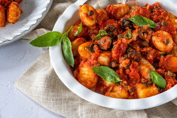 Potato gnocchi with puttanesca sauce