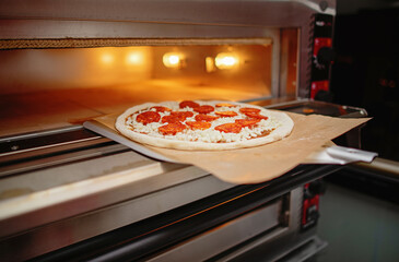  Process of cooking pepperoni pizza in the oven