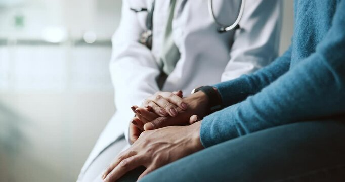 Doctor, person and holding hands with empathy and support for cancer news and diagnosis. Healthcare, consultation and helping with kindness and advice for chemotherapy and wellness at clinic