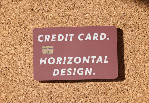 Credit card on Cork Board Surface in Sunlight