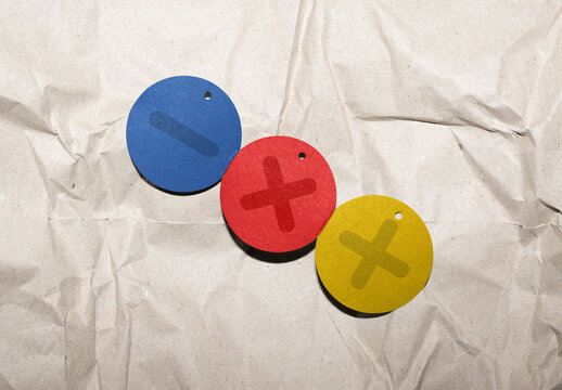 Green Circular Hang Tags Arranged on Crumpled Paper