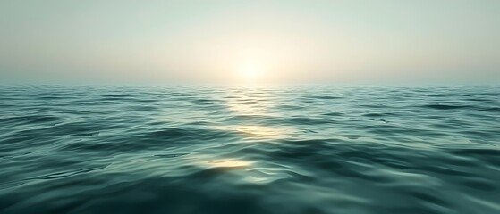 Obraz premium Tranquil ocean waters at sunrise, featuring soft waves reflecting the pale light, evoking a sense of calm and serenity in a serene atmosphere.