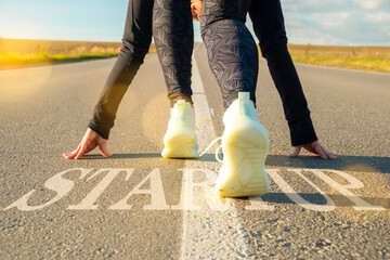 Startup of success in business, achievement of goals, plans. Female legs at beginning of path on...