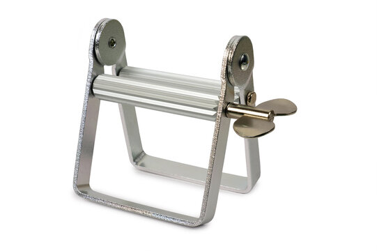 Aluminum tube squeezer dispenser tool isolated on a white background