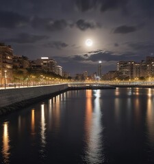 Fototapeta premium Full moon casting a silver glow on the Diagonal Mar waterfront in Barcelona, waves, barcelona, ocean view