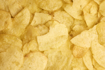 A closeup image showcasing the delightful, crispy, and crunchy texture of potato chips