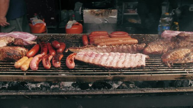 Traditional Spain Barbecue with various cuts of meat, ribs, sausages.