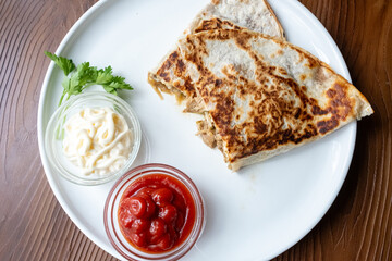 Close-up of local Mexican dish chicken mushroom quesadilla in slow motion