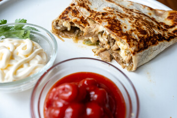 Close-up of local Mexican dish chicken mushroom quesadilla in slow motion