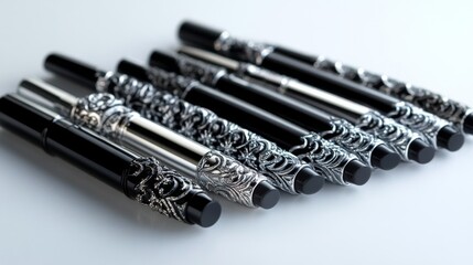 Fototapeta premium Ornate Black and Silver Pens Arranged in a Row