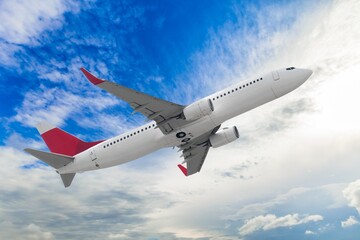 Obraz premium Airplane flying in blue sky, travel background