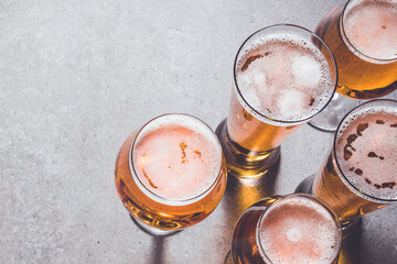 Beer glasses on gray stone background