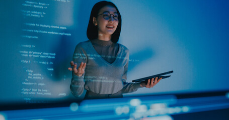 Group adult Asia female software developer mentor leader manager talk strategy plan to executive write prompt AI bot IT app program nomad, video game, designer, data center. Projecting slideshow code.