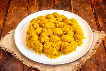 Traditional Brazilian dish chicken with pequi (caryocar brasiliense) and rice