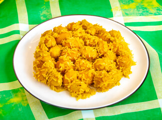 Traditional Brazilian dish chicken with pequi (caryocar brasiliense) and rice