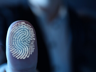 Woman pressing finger to surface showing friction ridges pattern, closeup. Scanning fingerprint