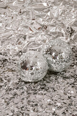 Silver foil background with disco balls