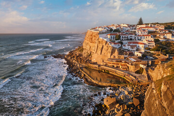 Scenic view of the seaside Azenhas do Mar fishing village on cliff on Atlantic ocean coast,...