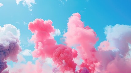 Fototapeta premium Vibrant pink smoke plumes against a clear blue sky