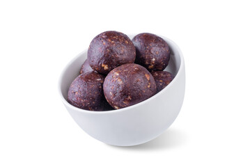 Obraz premium Nuts dates cocoa powder vegetarian balls in a white bowl on a white isolated background