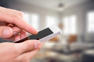 Human using mobile phone with blank screen