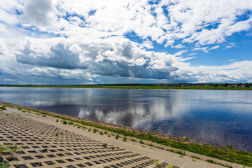 Summer landscape, beautiful low northern clouds over the Northern Dvina river, Veliky Ustyug
