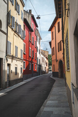 Fototapeta premium A view of the colorful streets of Milan. Windows with flowers. Italy