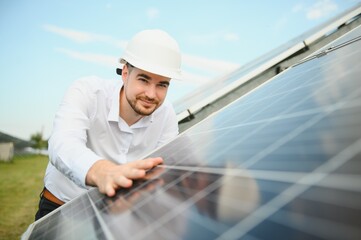 The solar farm, solar panel with engineer check the operation of the system, Alternative energy to...