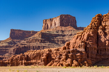 Fototapeta premium High sandstone cliffs of Island in the Sky district in Canyonlands National Park seen from the Potash Road