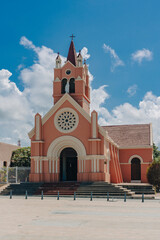 Barranquilla, Atlantico, Colombia. October 24, 2024: Beautiful church with a pink facade. Iglesia del Carmen in Puerto Colombia.