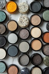 Artful Arrangement of Colorful Cosmetic Powders on a Marble Surface