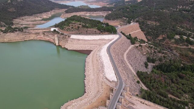 This is an Aerial View showcasing the striking features of a Reservoir and its Dam