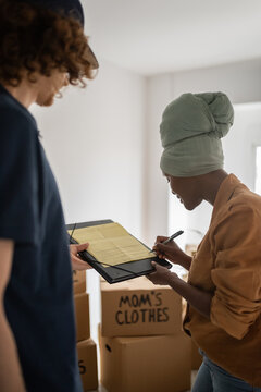 Girl signing documents for transportation service