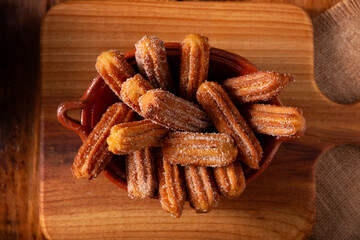 Churros. Fried wheat flour dough, a very popular sweet snack in Spain, Mexico and other countries where it is customary to eat them for breakfast or snack accompanied by hot chocolate or coffee.