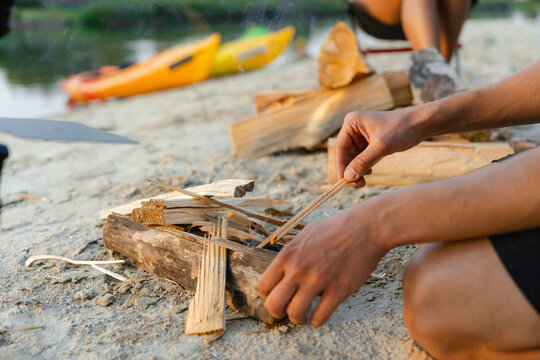 A man lights a fire