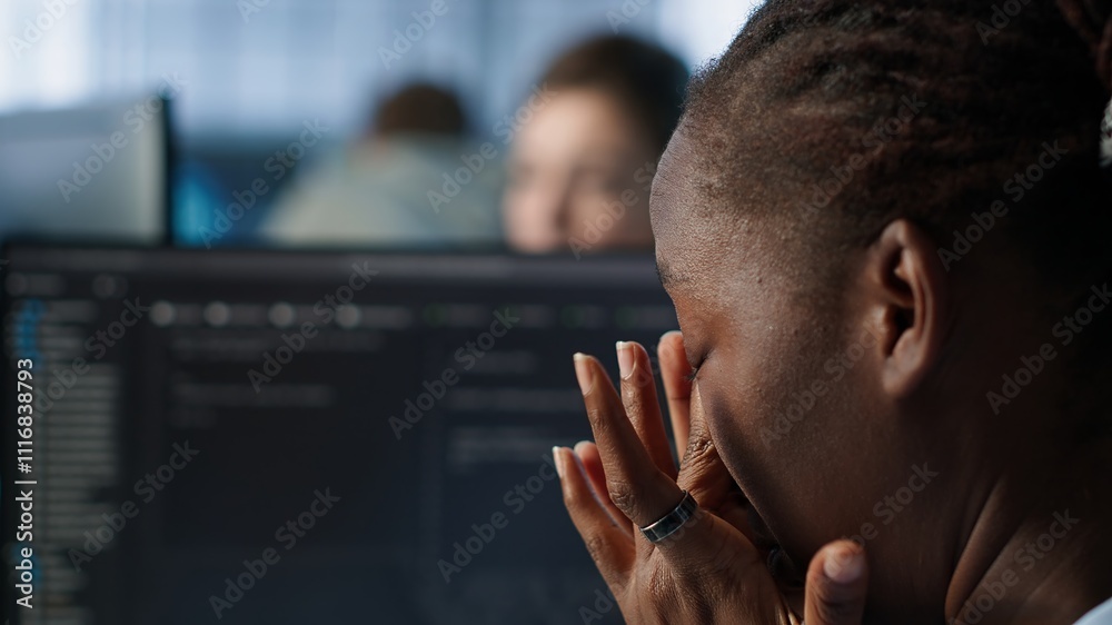 Poster tired software developer having eye strain while working on high tech data center computer. overwork