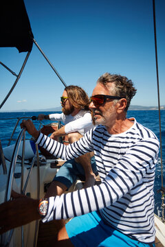 Father and son sail the sea