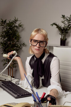 Confident Professional Working at a Desk in a Modern Office 