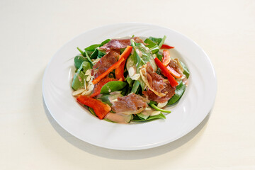 A plate of food with a salad on it